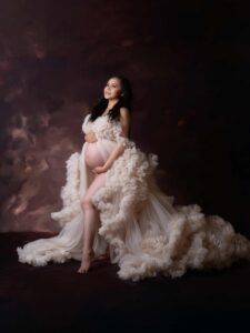 pregnant woman posing for a maternity photography session in Calgary by Tiara Tran Photography