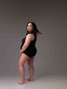 Calgary maternity photoshoot by Tiara Tran - pregnant woman wearing black bodysuit