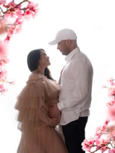 Pregnant couple looking at each other during a maternity photography session in Calgary