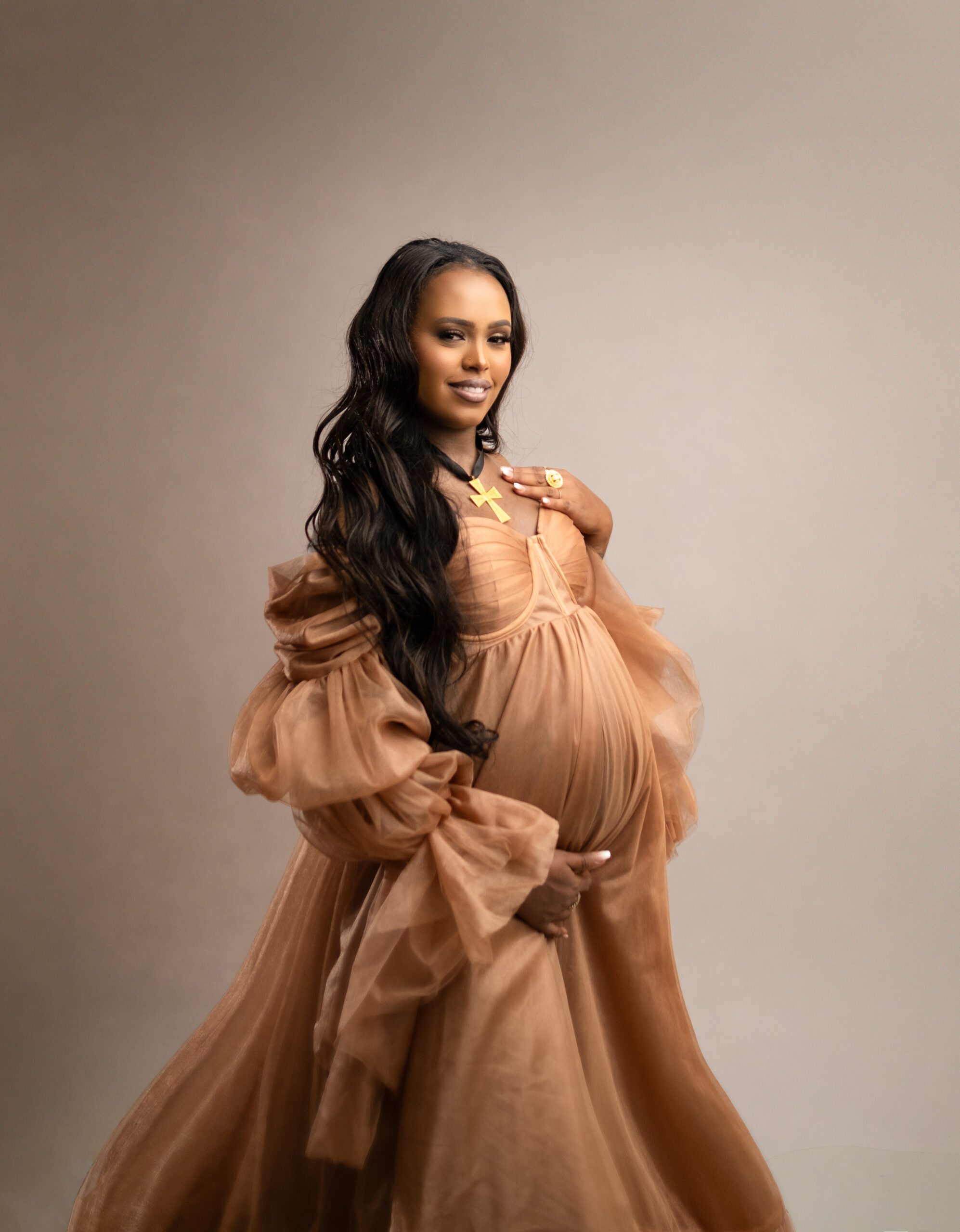 Calgary maternity photography by Tiara Tran - pregnant mom wearing a golden gown