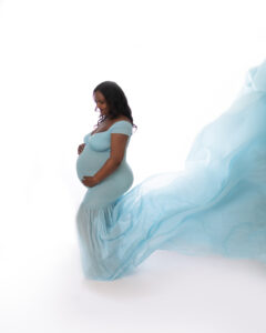 Maternity Photography Calgary - pregnant woman wearing a blue gown