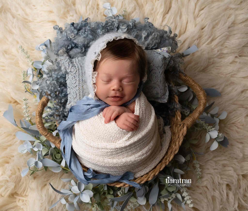 Calgary newborn photography baby sleeping in a basket