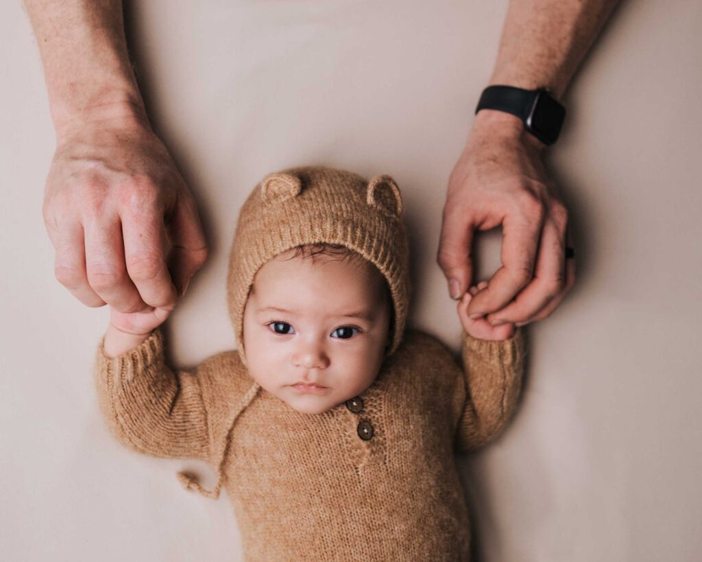 Newborn baby opens their eyes in a photoshoot in Calgary