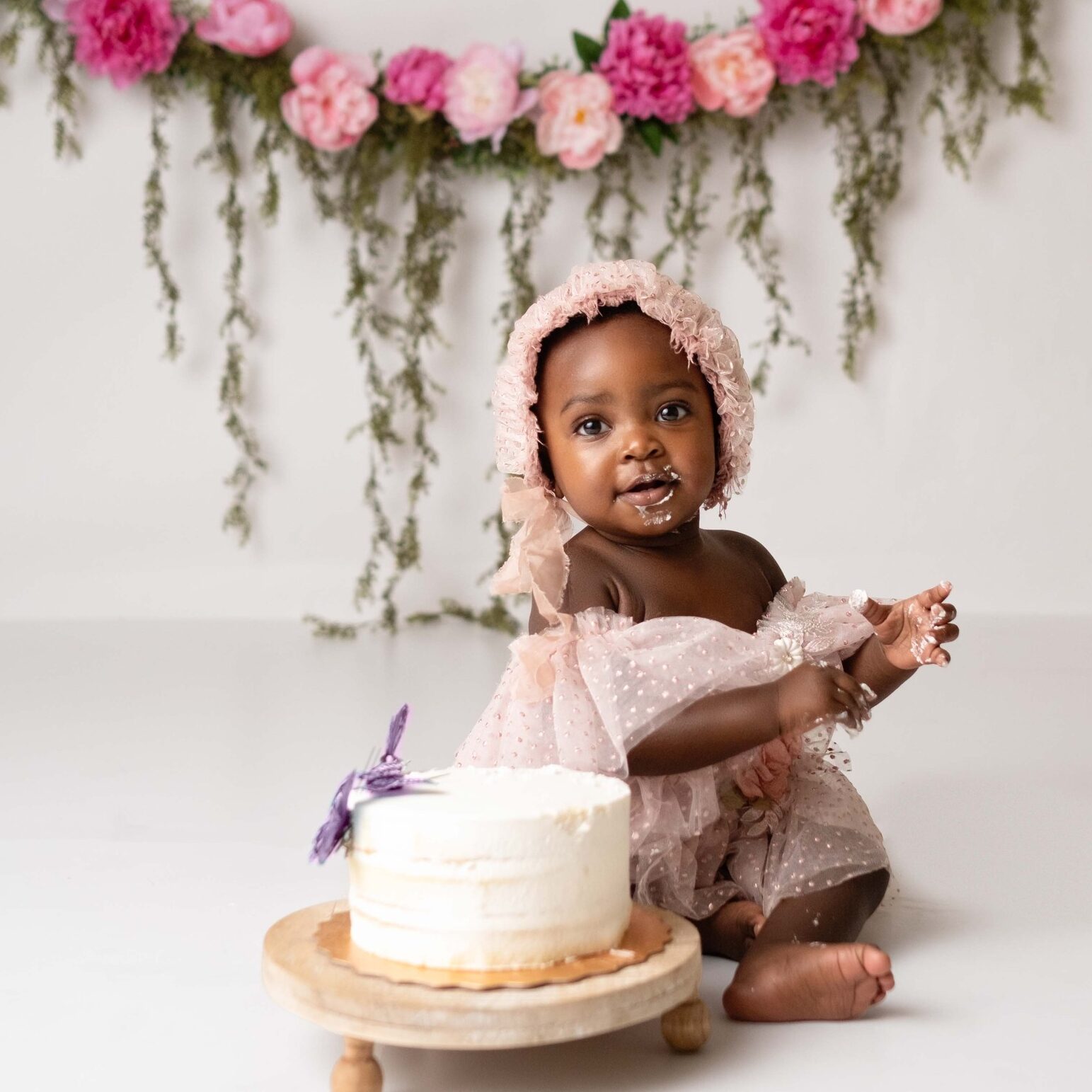 baby girl at her first birthday photoshoot in a Calgary studio