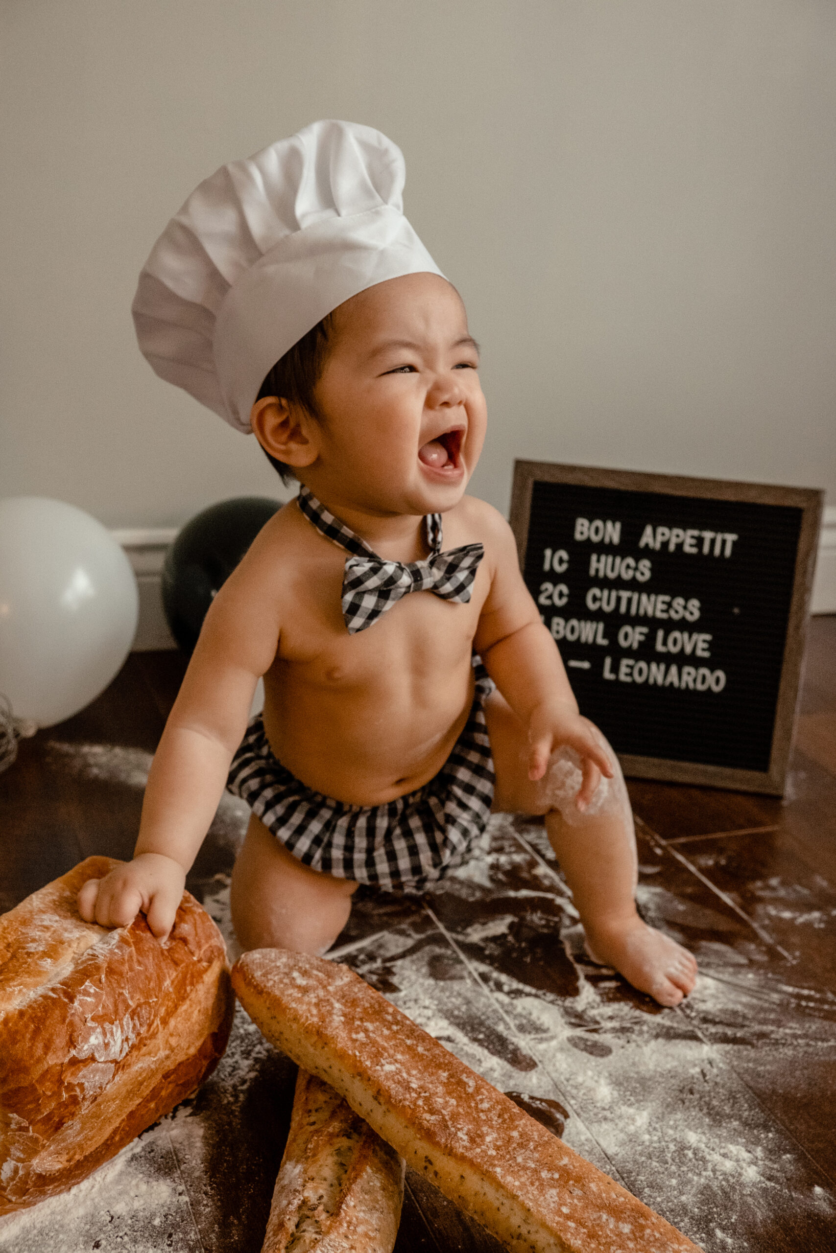 baby boy doing a photoshoot to celebrate his first birthday