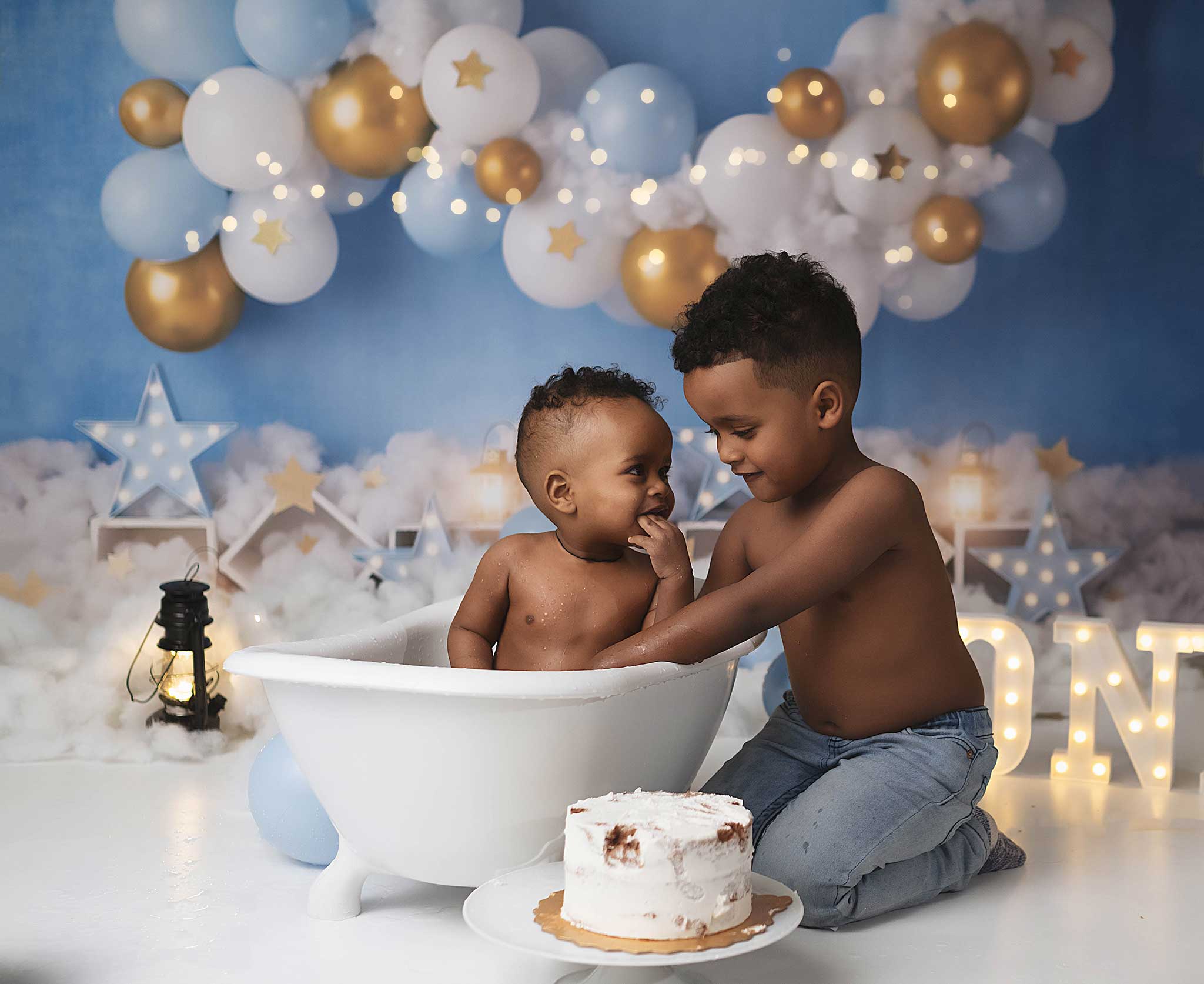 baby boy doing a photoshoot to celebrate his first birthday