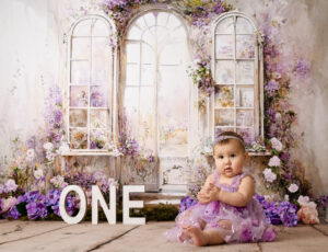 baby posing for her first birthday photoshoot, cake smash photos in Calgary studio